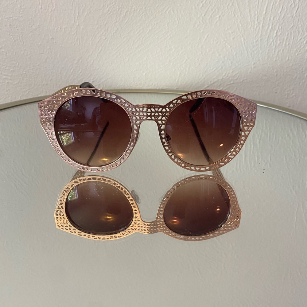 Gold metal sunglasses.